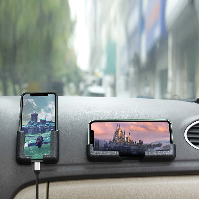 Mobile phone holder on car dashboard, securely holding two devices for navigation and entertainment.