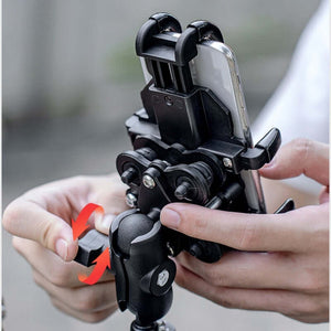 Shockproof mobile phone bracket securely holding a smartphone, perfect for motorcycle and electric bike navigation.