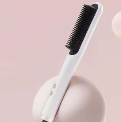 White straight hair curler with comb attachment on a soft pink background, ideal for effortless styling.